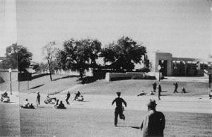 Photo taken by Wilma Bond, depicting officers McLain and Courson on Elm Street in front of the grassy knoll