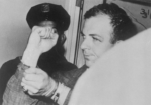 Oswald has a ring on his left hand.