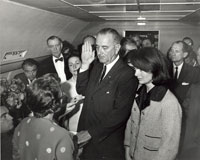 President Johnson being sworn in aboard Air Force One.