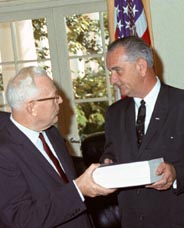 Earl Warren handing the completed Warren Report to President Johnson, 24 Sep 1964. Photo by Cecil Stoughton.