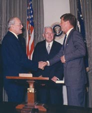 President Kennedy shaking hands with outgoing CIA Director Allen Dulles, 29 Nov 1961. Incoming DCI John McCone is at center. Dulles was head of CIA when assassination plots were first begun.