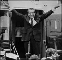 Richard Nixon boarding a helicopter after resigning