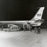 Casket being unloaded into hearse from Air Force One, at Andrews Air Force Base on the evening of 22 Nov 1963.